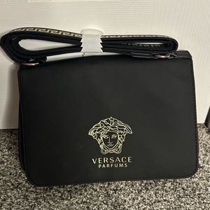 Versace parfums small black purse never used